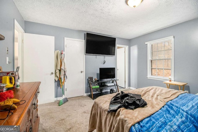 carpeted bedroom featuring a textured ceiling