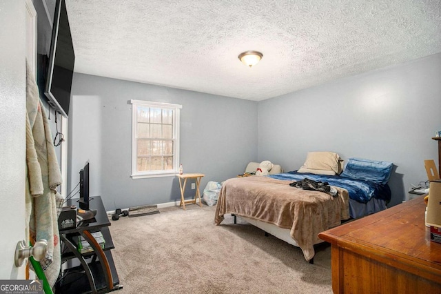 carpeted bedroom featuring a textured ceiling