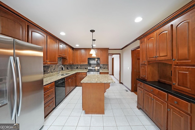 kitchen featuring sink, black appliances, light stone countertops, a kitchen island, and decorative light fixtures