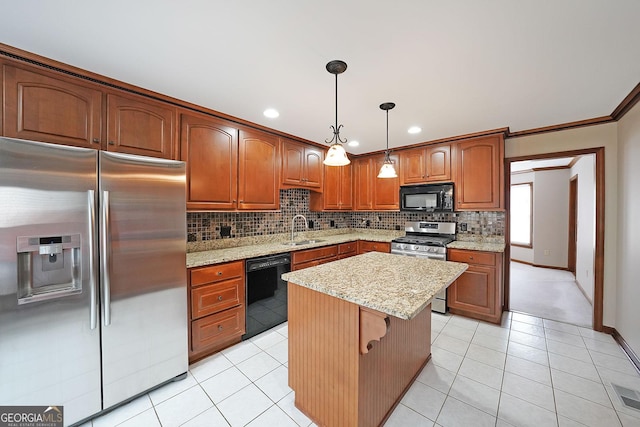 kitchen featuring decorative light fixtures, a center island, backsplash, and black appliances