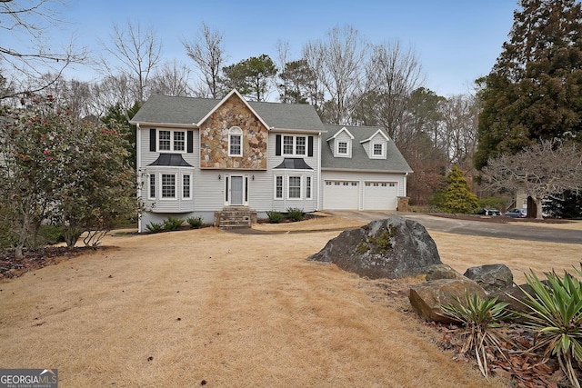 view of front of property with a garage