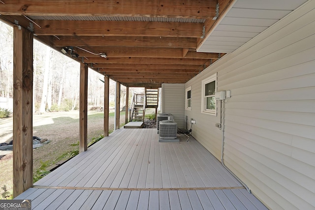 wooden deck with central air condition unit