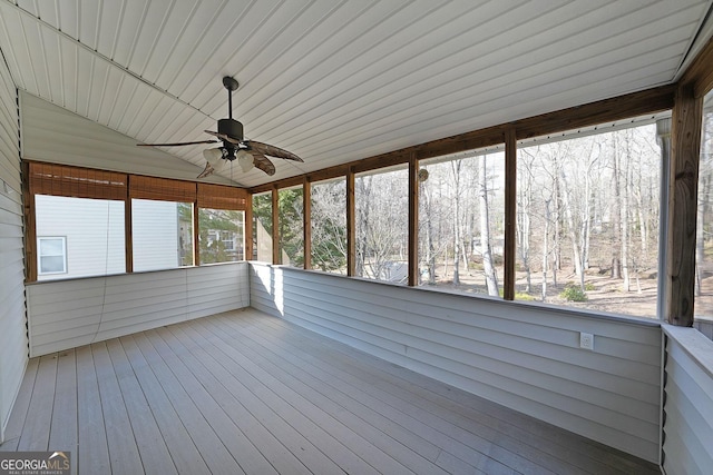 unfurnished sunroom featuring lofted ceiling and ceiling fan