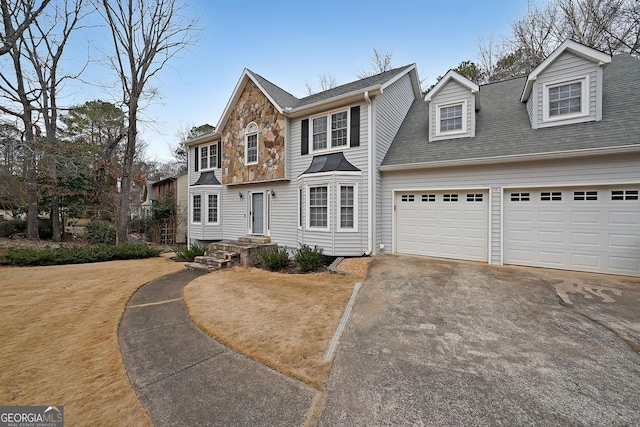 view of front of property with a garage