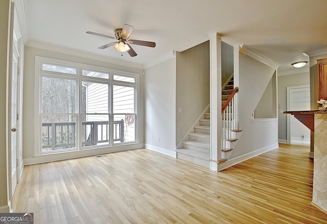 unfurnished living room with crown molding, light hardwood / wood-style floors, and ceiling fan