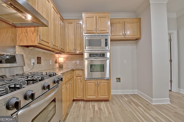 kitchen featuring light stone counters, ventilation hood, light brown cabinets, ornamental molding, and stainless steel appliances