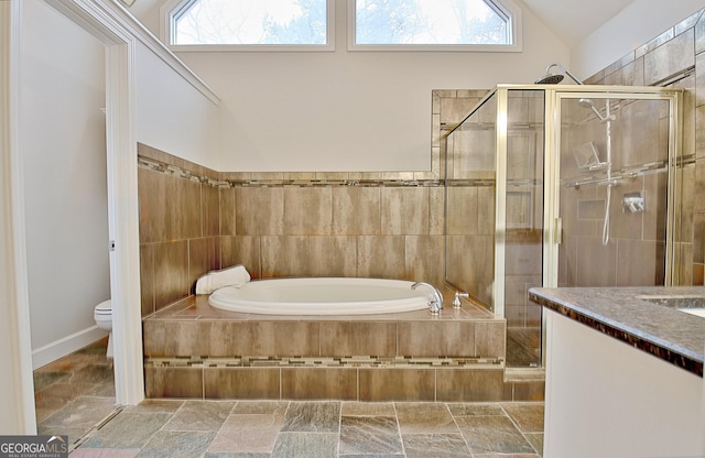 full bathroom with lofted ceiling, toilet, separate shower and tub, and a wealth of natural light