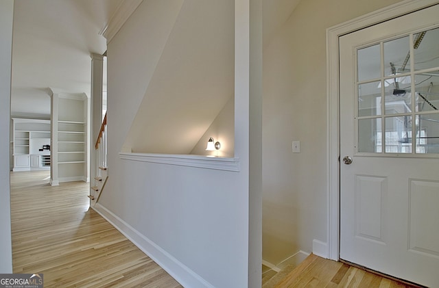 hall with light hardwood / wood-style floors