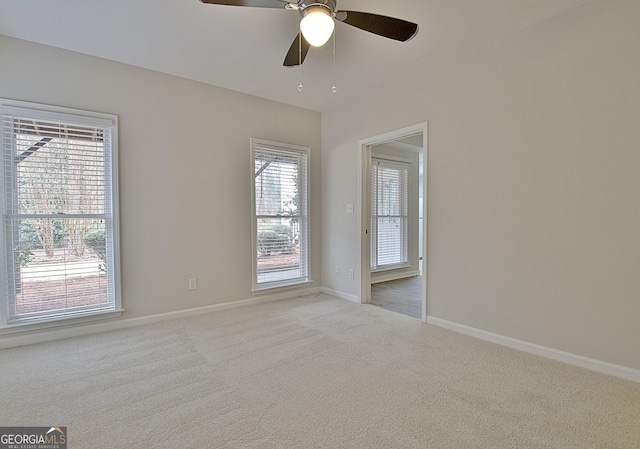 carpeted empty room with ceiling fan