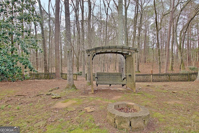 view of yard with an outdoor fire pit