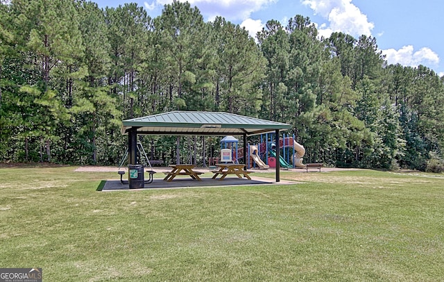 exterior space featuring a gazebo, a playground, and a lawn