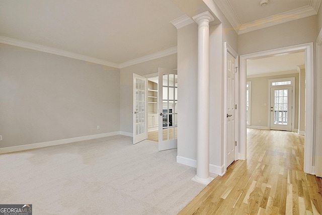 hallway with french doors, ornamental molding, decorative columns, and light hardwood / wood-style flooring