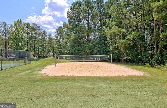 view of community with a yard and volleyball court