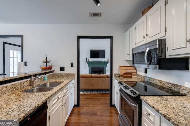 kitchen featuring white cabinetry, sink, dark hardwood / wood-style flooring, and stainless steel appliances