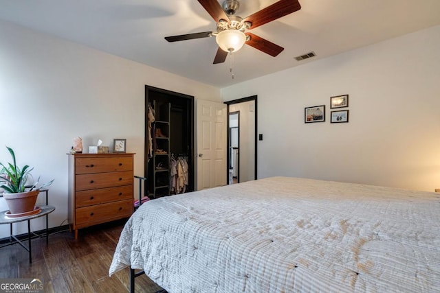 bedroom with ceiling fan and dark hardwood / wood-style flooring