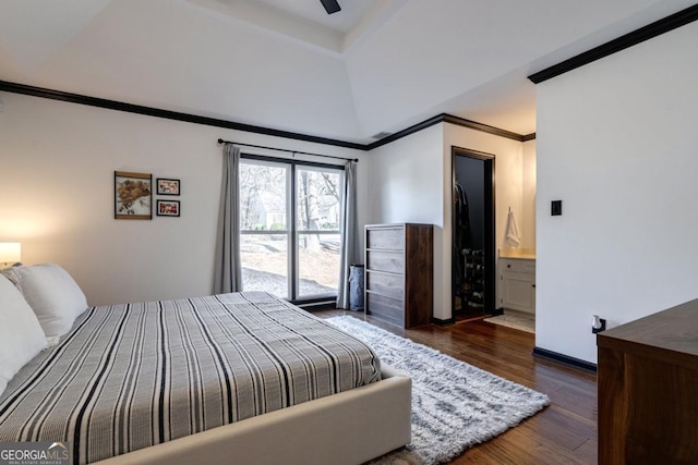 bedroom with ornamental molding, dark hardwood / wood-style floors, and ceiling fan