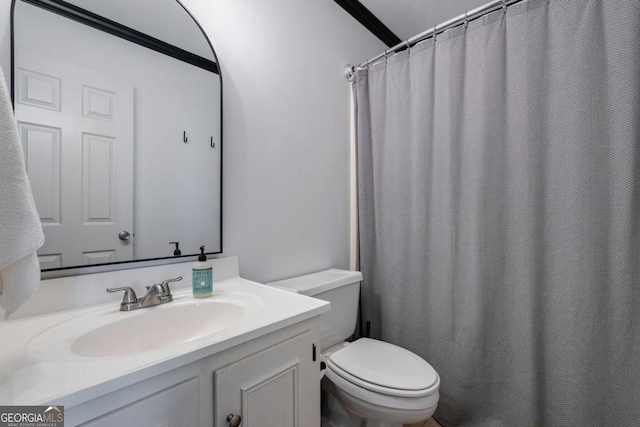 bathroom with vanity and toilet