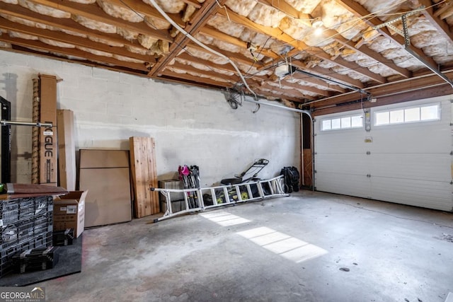 garage with a garage door opener and refrigerator