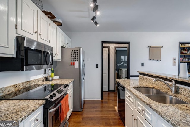 kitchen with white cabinetry, appliances with stainless steel finishes, dark hardwood / wood-style flooring, and sink