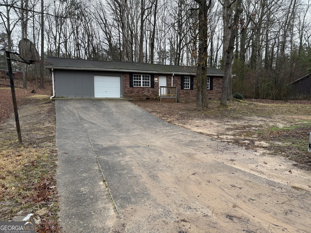 single story home featuring a garage