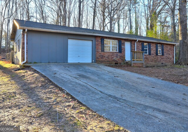 single story home featuring a garage