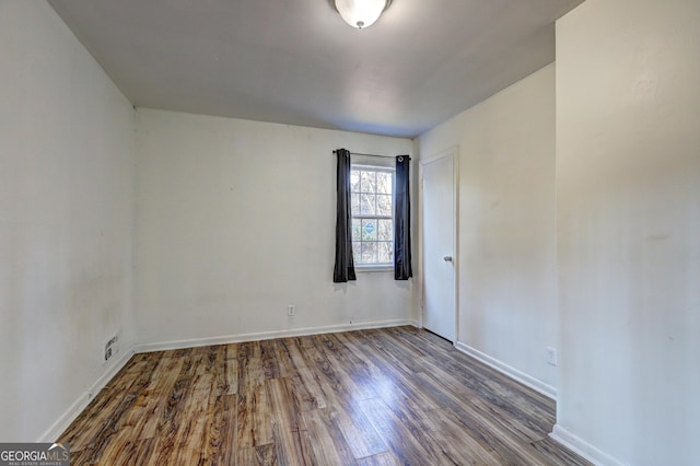 empty room featuring hardwood / wood-style flooring