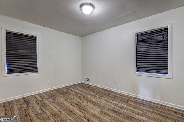 empty room with wood-type flooring