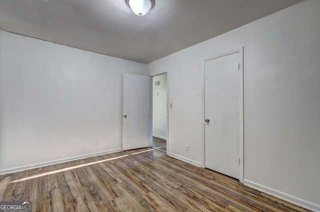 spare room featuring hardwood / wood-style floors