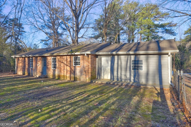 view of outbuilding featuring a yard