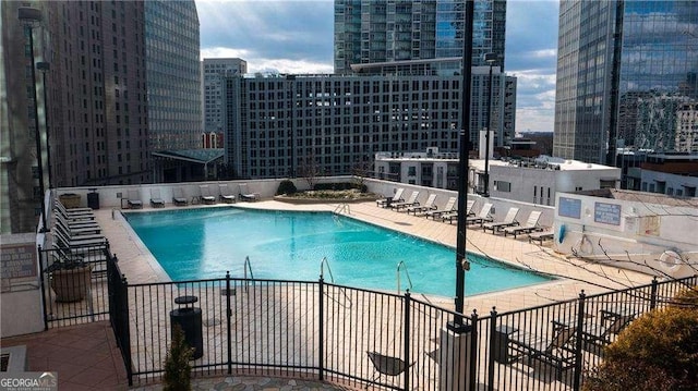 view of pool featuring a patio area