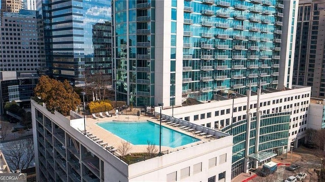 view of swimming pool with a patio area