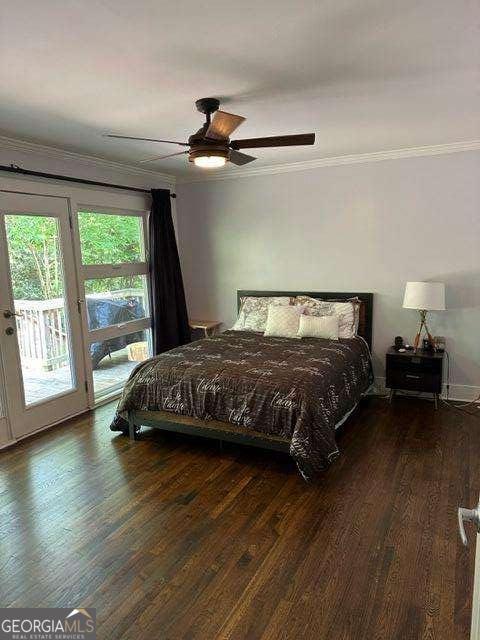 bedroom with ceiling fan, dark wood-type flooring, access to outside, and ornamental molding