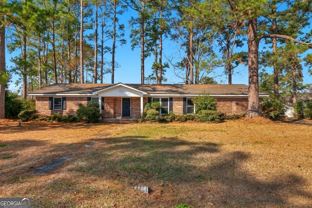 ranch-style house with a front lawn