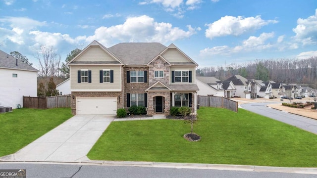 view of front of home featuring a garage and a front yard