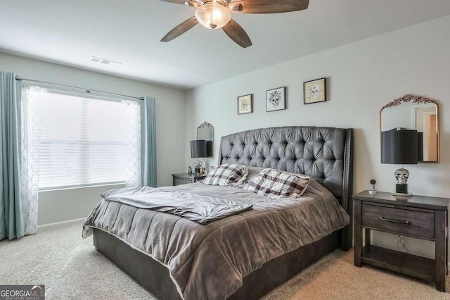 carpeted bedroom with ceiling fan