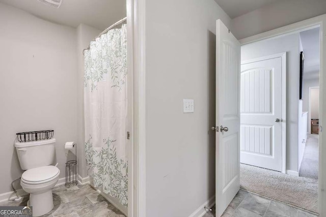 bathroom featuring toilet