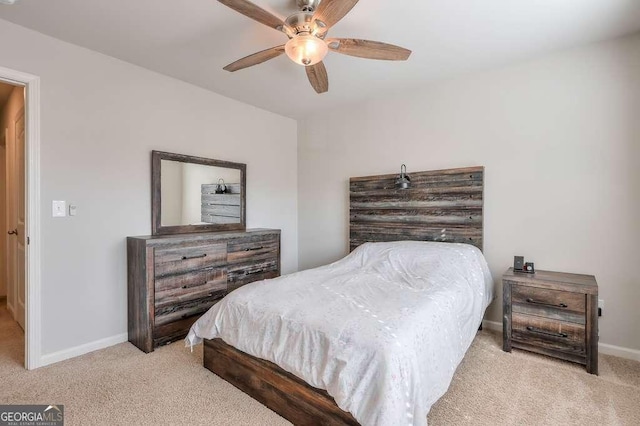 bedroom featuring light colored carpet and ceiling fan