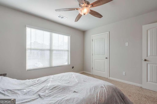 carpeted bedroom featuring ceiling fan