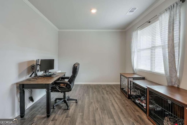 home office featuring wood-type flooring and ornamental molding