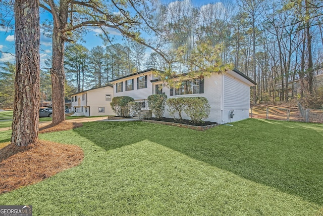 view of front facade with a garage and a front lawn