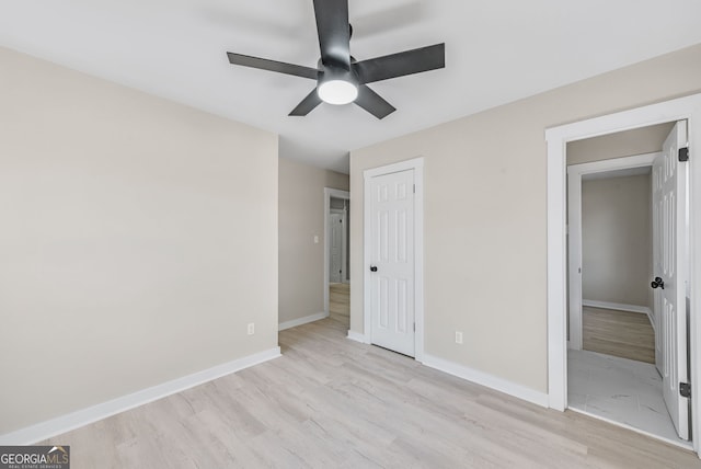 unfurnished bedroom with a closet, ceiling fan, and light hardwood / wood-style flooring