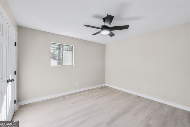 unfurnished room featuring light hardwood / wood-style floors and ceiling fan