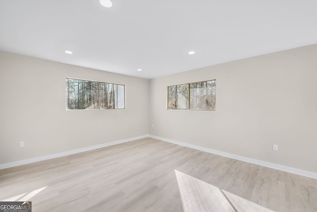 unfurnished room featuring light hardwood / wood-style flooring