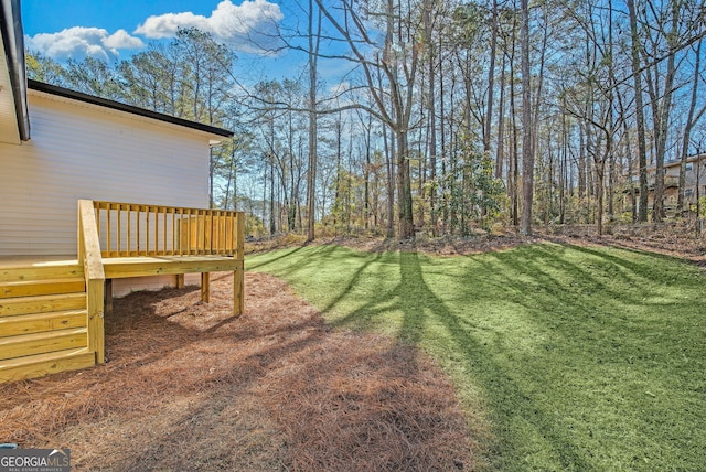 view of yard with a deck