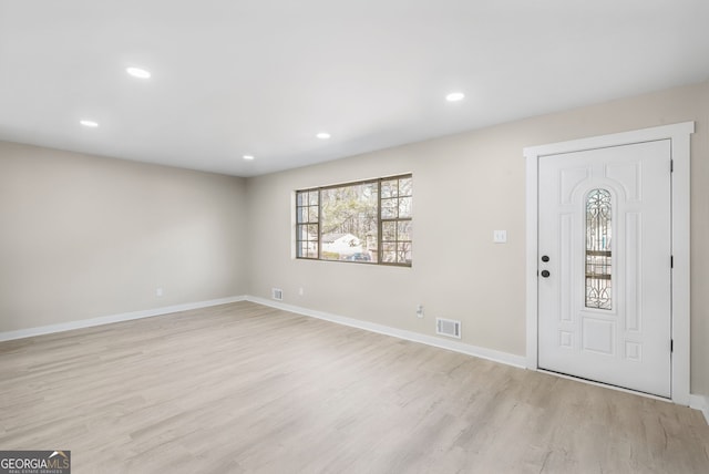 foyer with light wood-type flooring