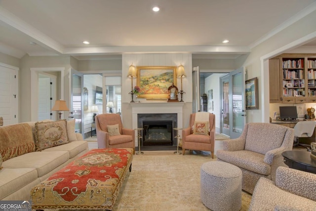 living area with a fireplace with flush hearth, ornamental molding, and recessed lighting