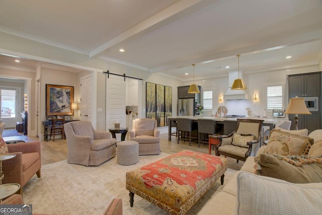 living room featuring recessed lighting, a wealth of natural light, beam ceiling, and a barn door