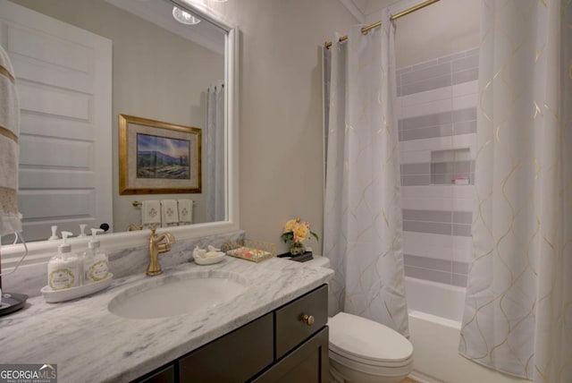 full bathroom featuring toilet, vanity, and shower / bath combo with shower curtain