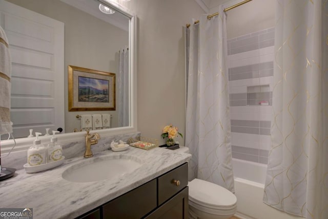 bathroom with shower / tub combo, toilet, and vanity