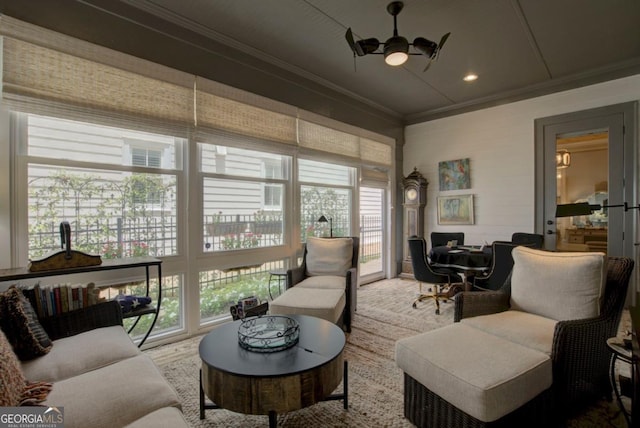 sitting room with a wealth of natural light, recessed lighting, ornamental molding, and ceiling fan